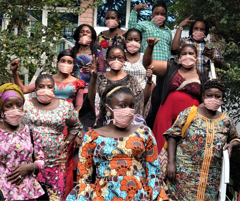 Women human rights defenders stand together after a PI workshop in DRC